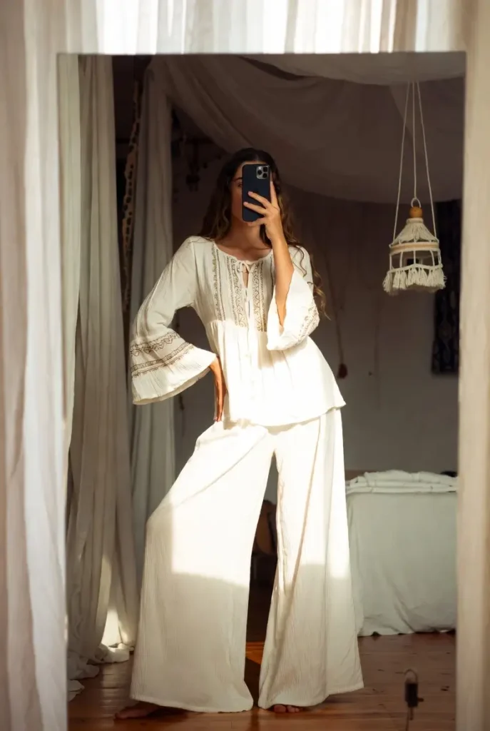 "Boho outfit ideas with white pants featuring flowy trousers and peasant top for relaxed vibe"