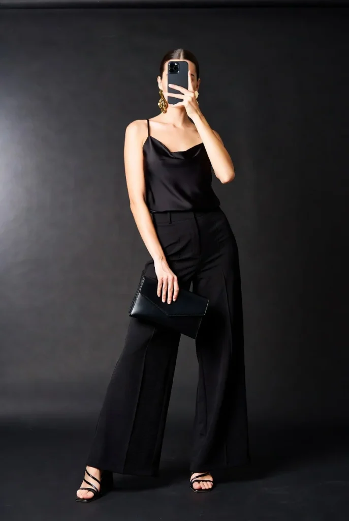 Chic date night look from 10 Clean Girl Outfit Ideas with a black satin cami and wide-leg trousers.