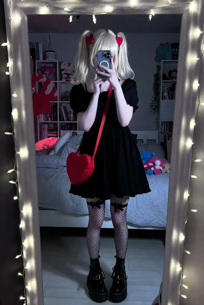 Black babydoll dress with platform boots and red heart bag — dark cutecore Roblox aesthetic outfits real life selfie