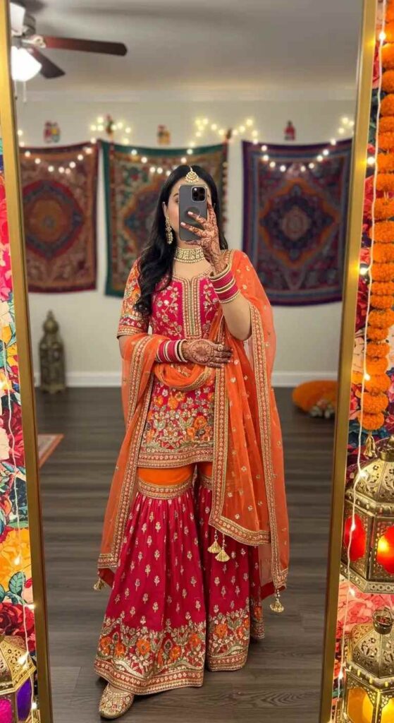 Vibrant red sharara set with dupatta in festive mirror selfie, glamorous Indian Birthday Outfit Ideas for Women.