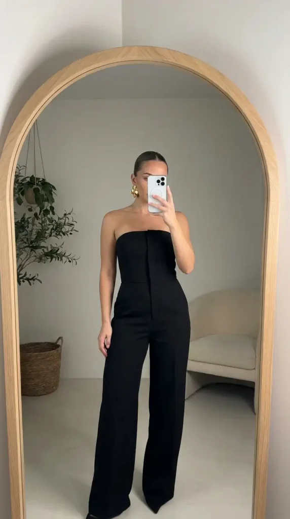 Black classy wedding guest jumpsuit summer in strapless tailored wide-leg structured style.

