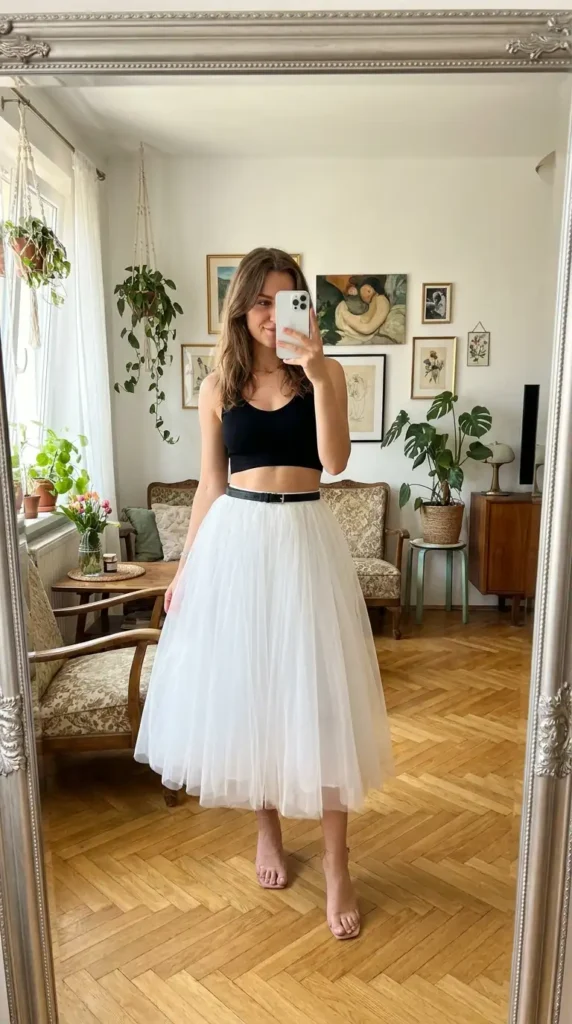 Black and White Outfit Ideas for Birthday Parties: black crop top with a dreamy white tulle midi skirt and clear heels