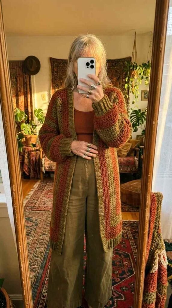 
Hippie outfits she'll adore: oversized rust crochet cardigan paired with olive wide-leg trousers.