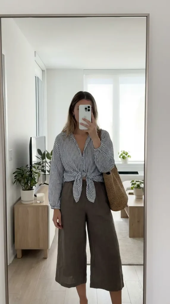Striped tie-front blouse with olive wide-leg culottes and rattan bag — summer family reunion outfit ideas