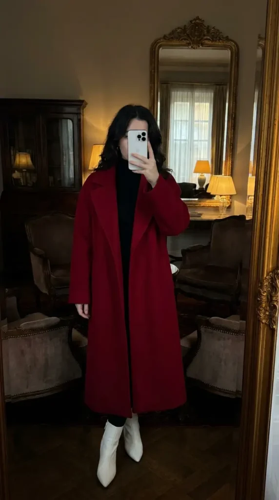 Long red coat over black turtleneck with white boots, an elegant Casual Red Black & White Outfits look.