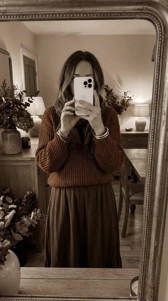Fall Long Red Skirt Outfit Ideas shown in a cozy rust sweater and scarf mirror selfie.