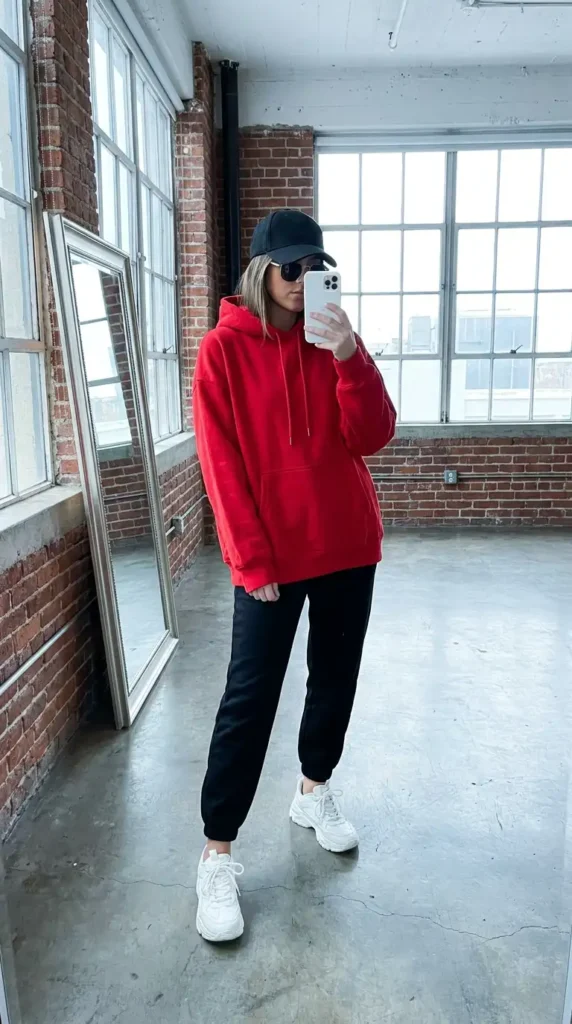 Red hoodie with black joggers and white sneakers, a comfy Casual Red Black & White Outfits look.