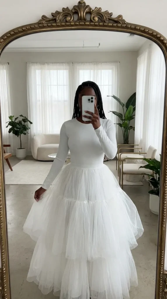 White bodysuit with tiered tulle skirt, dreamy All White Outfits for Black Women look