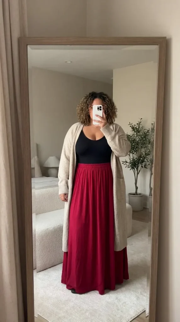 Curvy woman in black bodysuit, long cardigan and red skirt, layered Long Red Skirt Outfit Ideas for Plus Size women